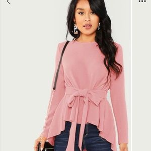 Asymmetrical pink blouse with tie
